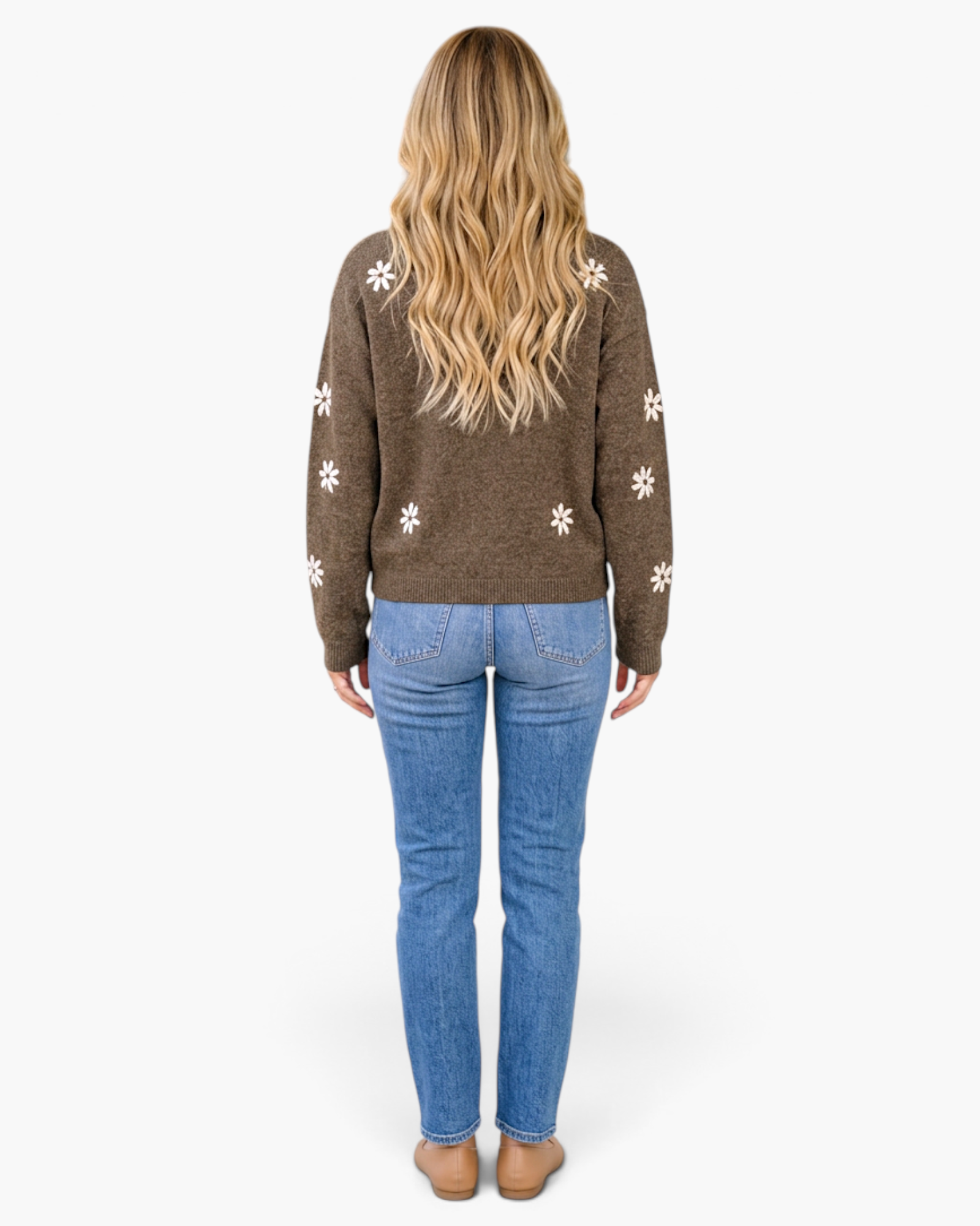 Beach Rose Co. chicory coffee brown knit sweater with cream floral patterns, worn with blue jeans, back view.