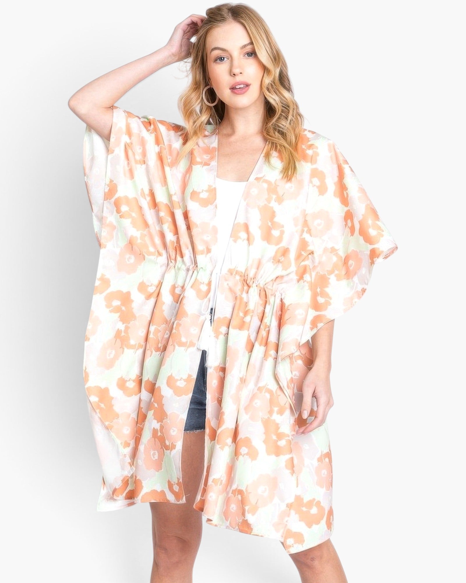 Beach Rose Co. floral print open-front cover-up with a drawstring waist worn by a blonde model on a white background.