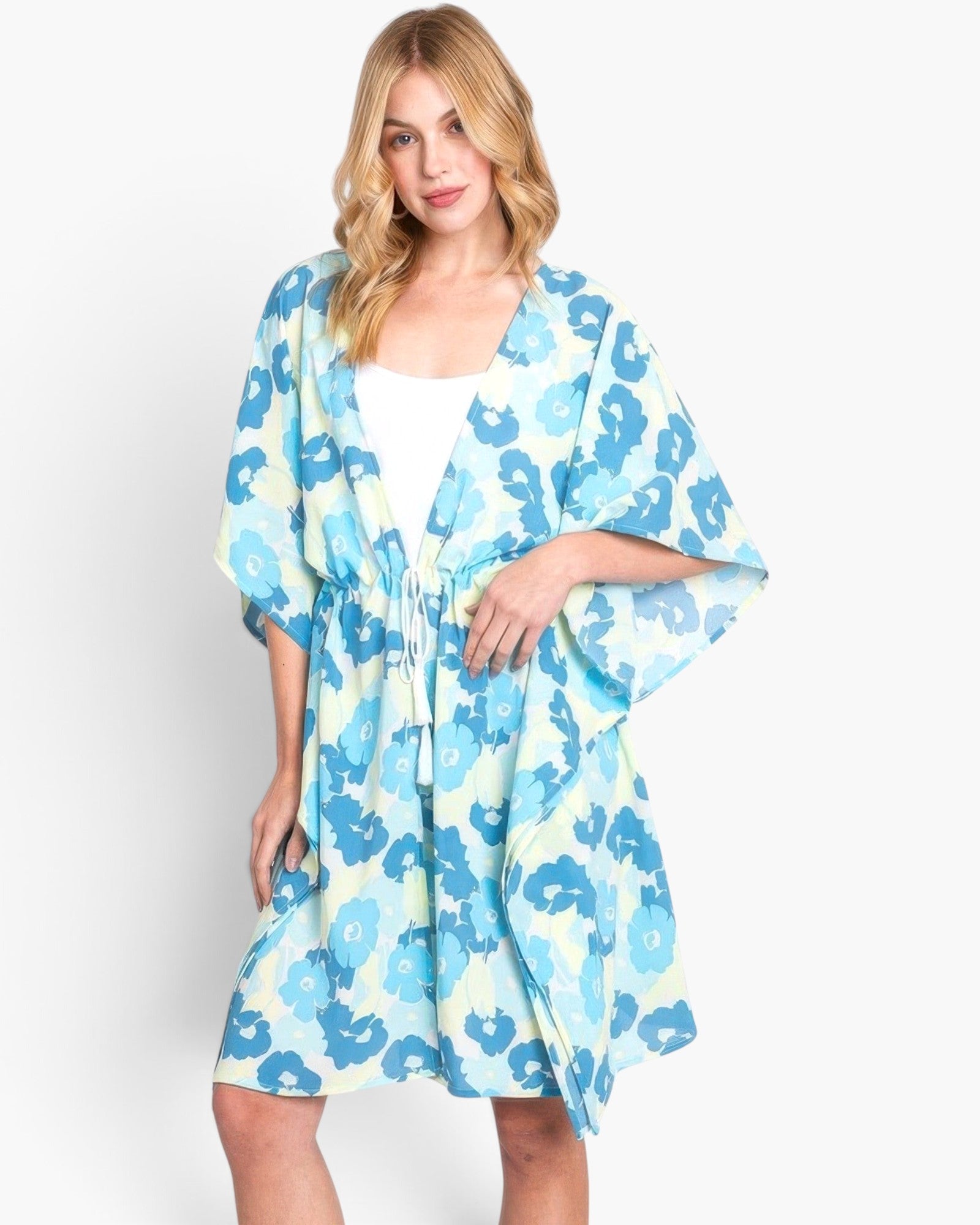 Beach Rose Co. floral print open-front cover-up with a drawstring waist worn by a blonde model over a white tank top