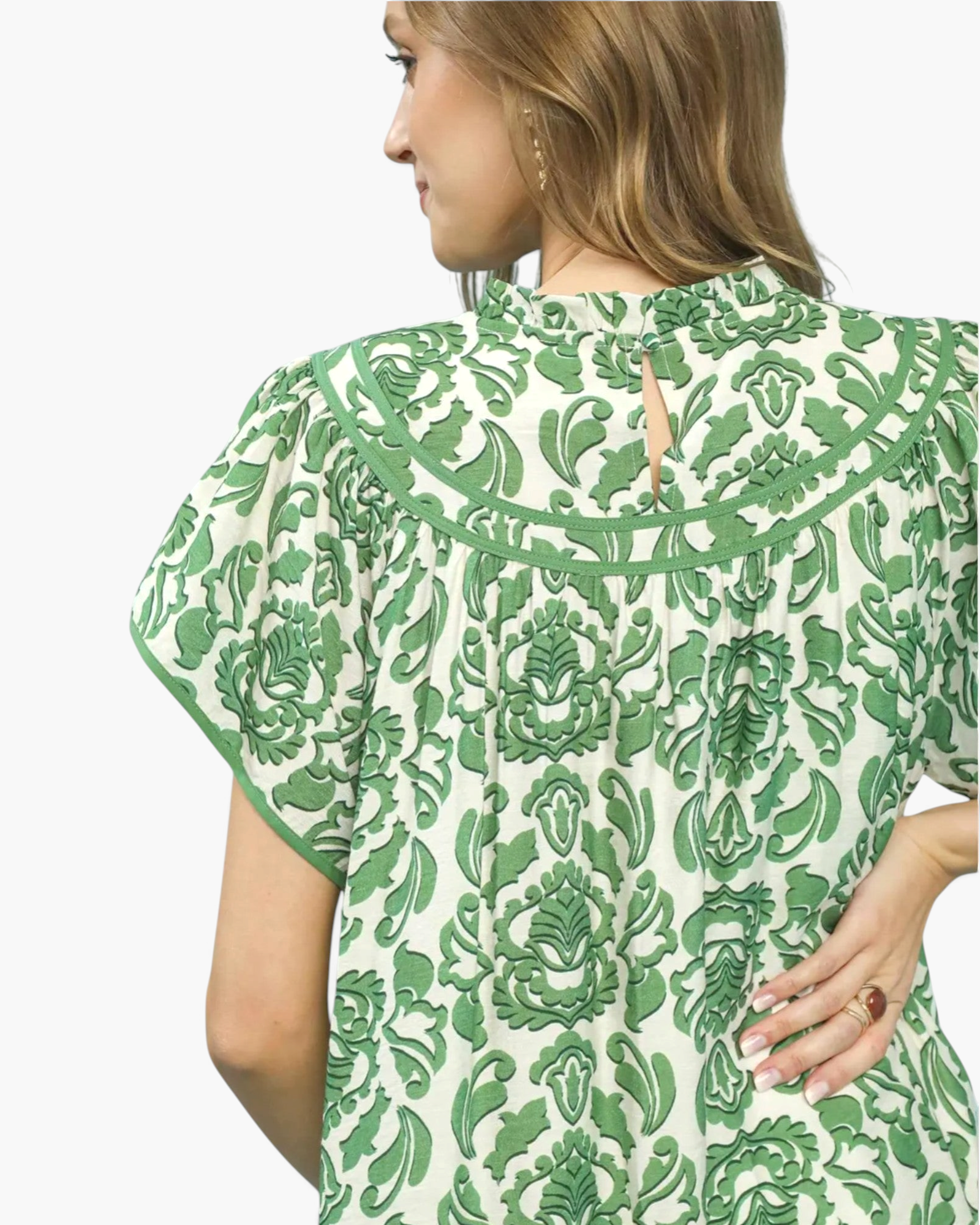 Beach Rose Co. green and cream floral mini dress with flutter sleeves, ruffled neckline, and back keyhole detail.