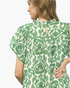 Beach Rose Co. green and cream floral mini dress with flutter sleeves, ruffled neckline, and back keyhole detail.