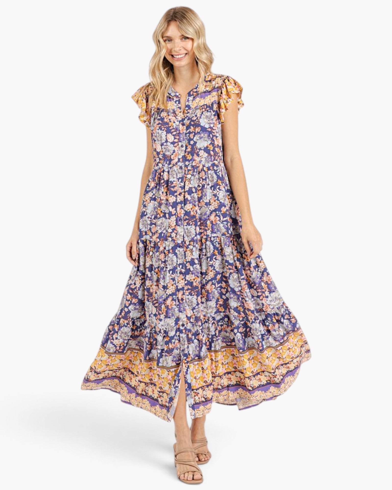 Beach Rose Co. peacock blue floral maxi dress with flutter sleeves, tiered silhouette, and contrasting border print.