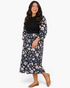 Beach Rose Co. plus size midi dress with black ribbed bodice and navy floral skirt with three-quarter balloon sleeves