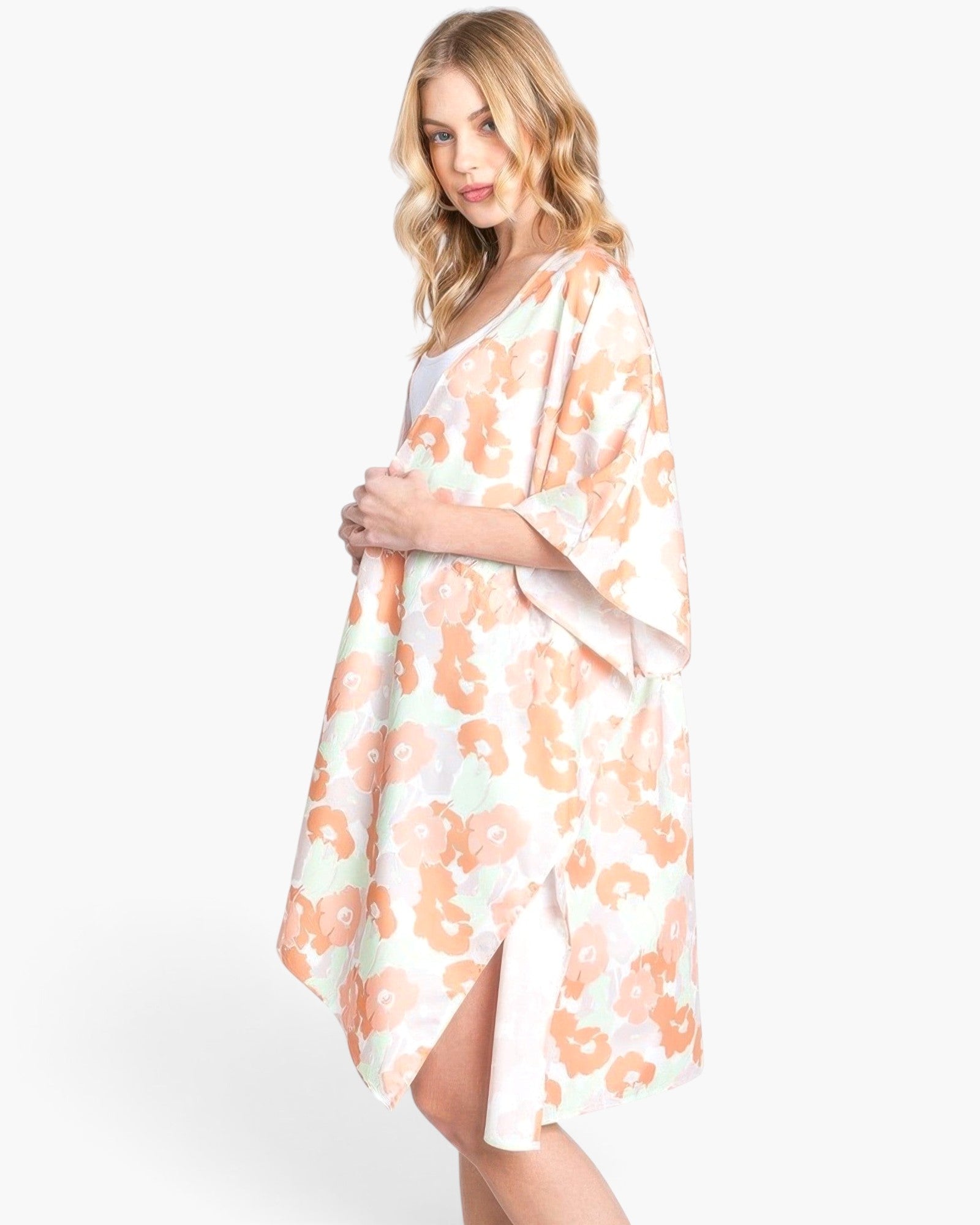 Beach Rose Co. floral print open-front cover-up in lightweight polyester with a self-tie waist on a blonde model