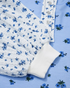 Beach Rose Co. floral print long sleeve top with buttoned contrast detail and ribbed cuffs in blue and white.
