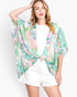 Beach Rose Co. floral print cover-up in lightweight polyester with an open front, worn by a blonde model.