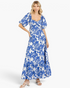 Beach Rose Co. royal blue and white floral cotton maxi dress with puff sleeves and a sweetheart neckline on a model.