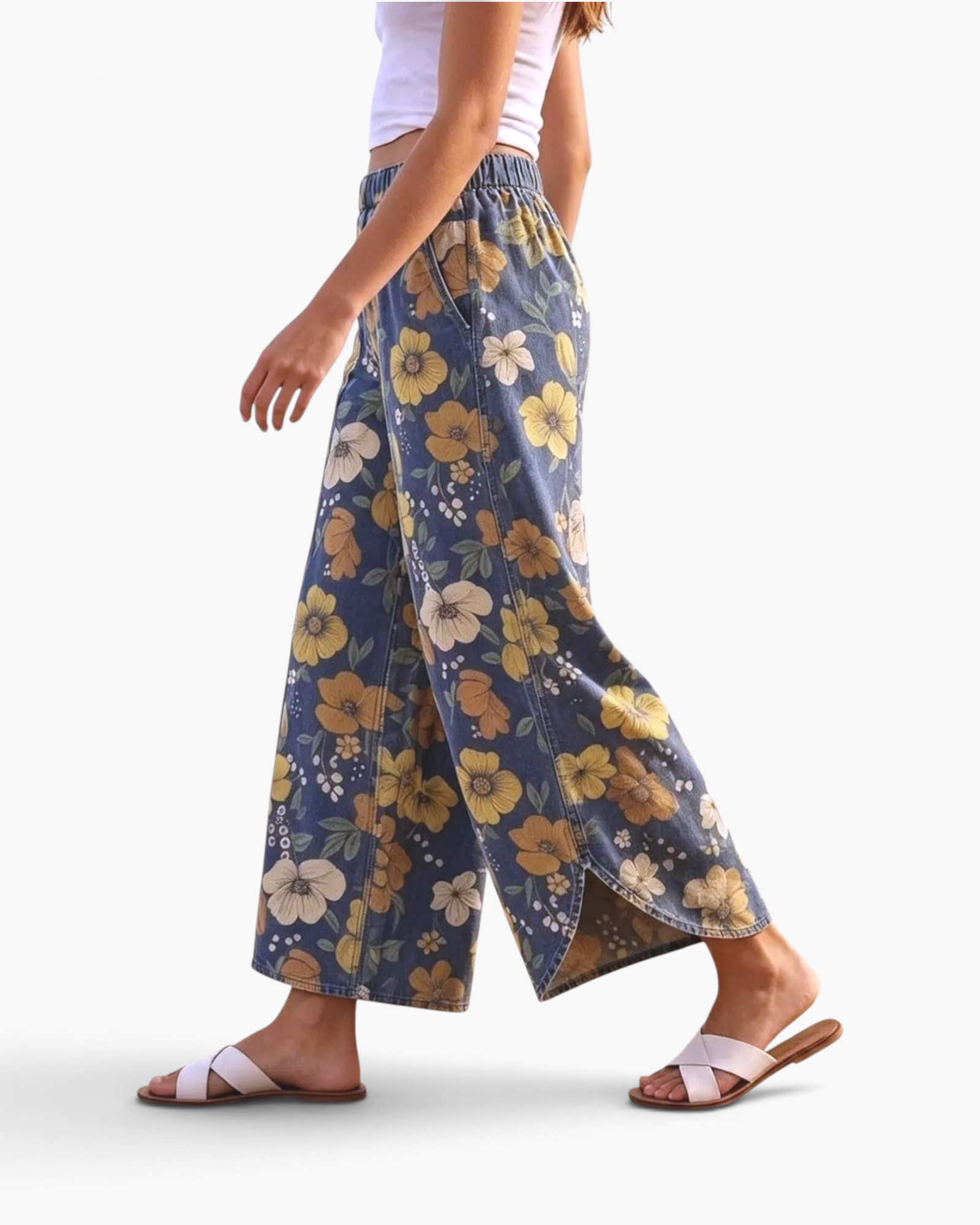 Beach Rose Co. blue floral print wide leg pants with curved side slits and elastic waist on a model