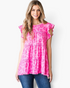 Beach Rose Co. fuchsia leopard print tiered top with flutter sleeves and a round neckline worn by a smiling woman.