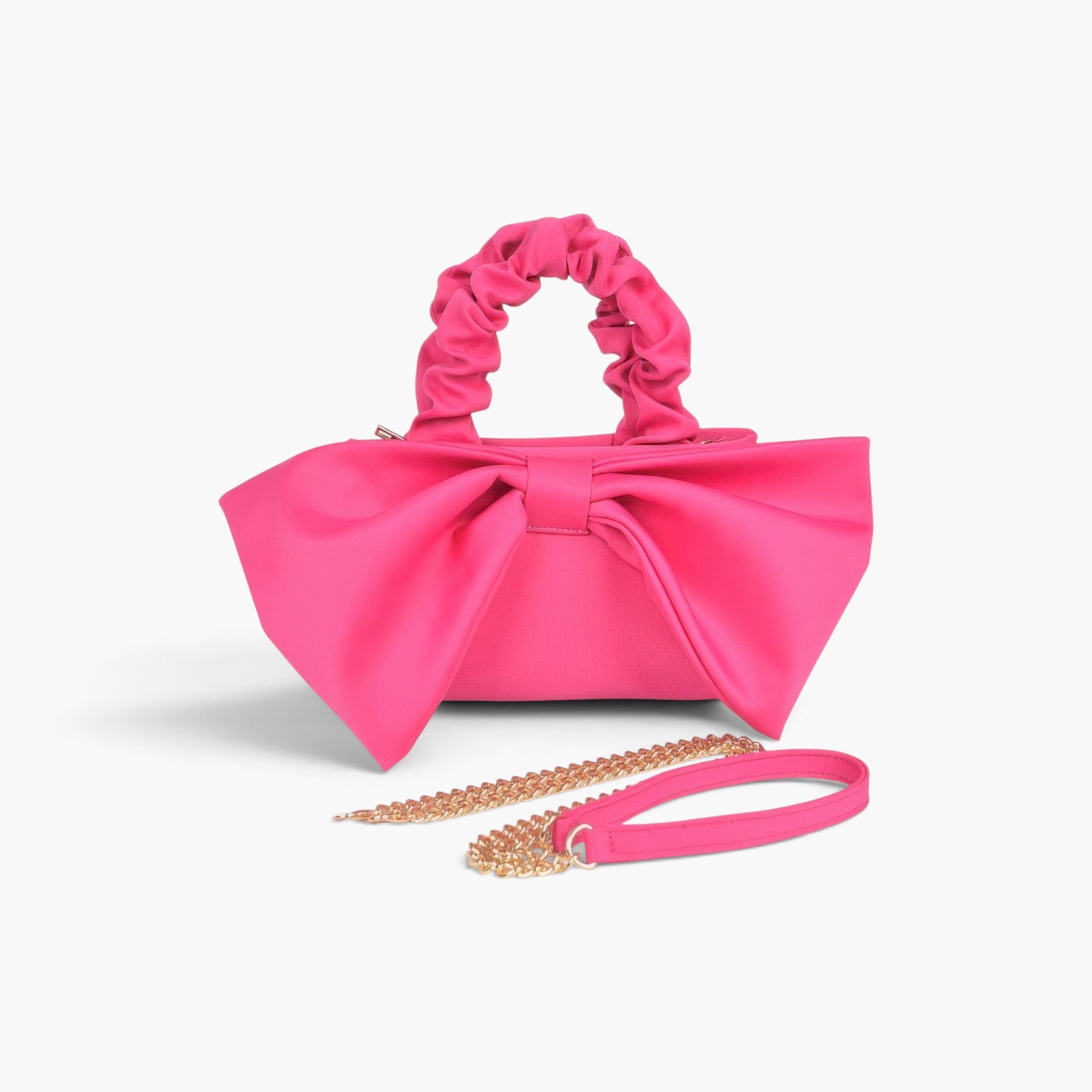 Beach Rose Co. fuchsia nylon clutch with a large front bow, ruched top handle, and detachable gold chain strap.