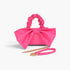 Beach Rose Co. fuchsia nylon clutch with a large front bow, ruched top handle, and detachable gold chain strap.