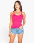 Beach Rose Co. fuchsia ribbed knit cami top worn by a woman with denim shorts against a white background