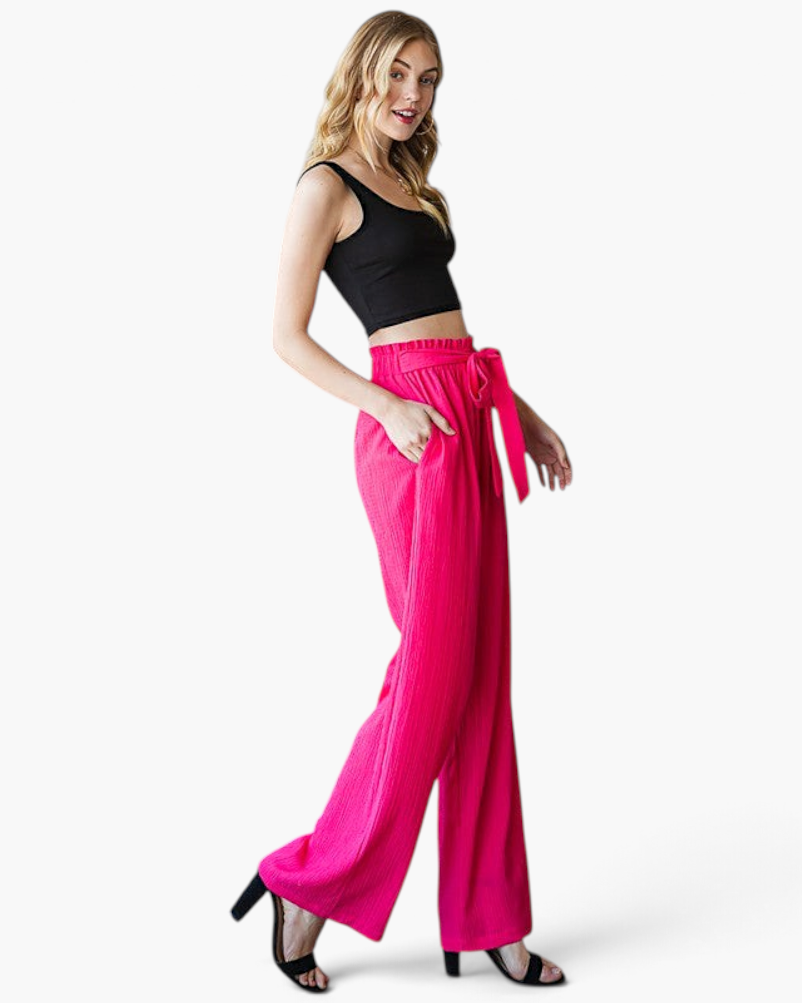 Beach Rose Co. fuchsia wide-leg pants with a ruffled elastic waistband and front tie on a model