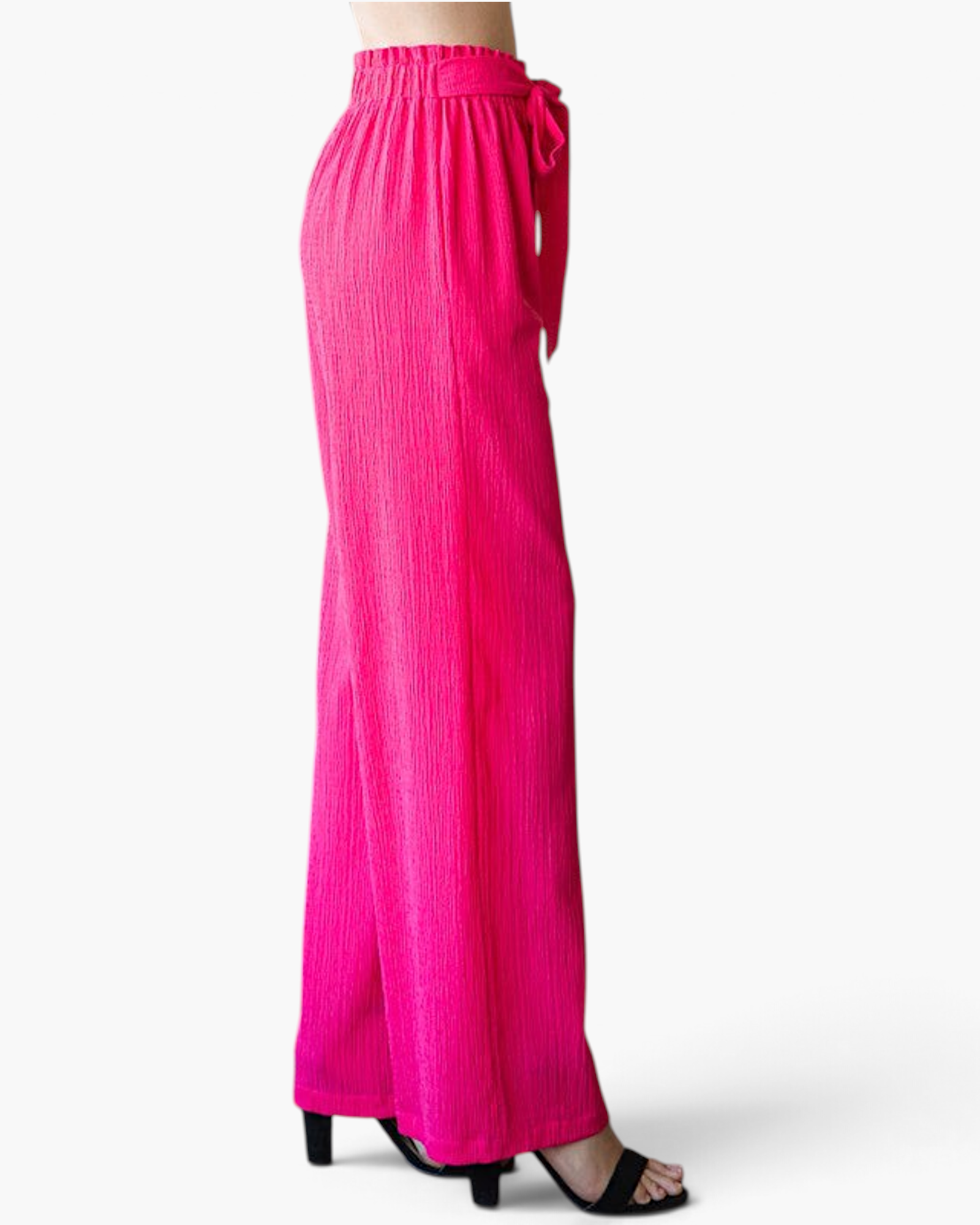 Beach Rose Co. fuchsia wide-leg pants with a textured finish, ruffled elastic waistband, and front tie detail.