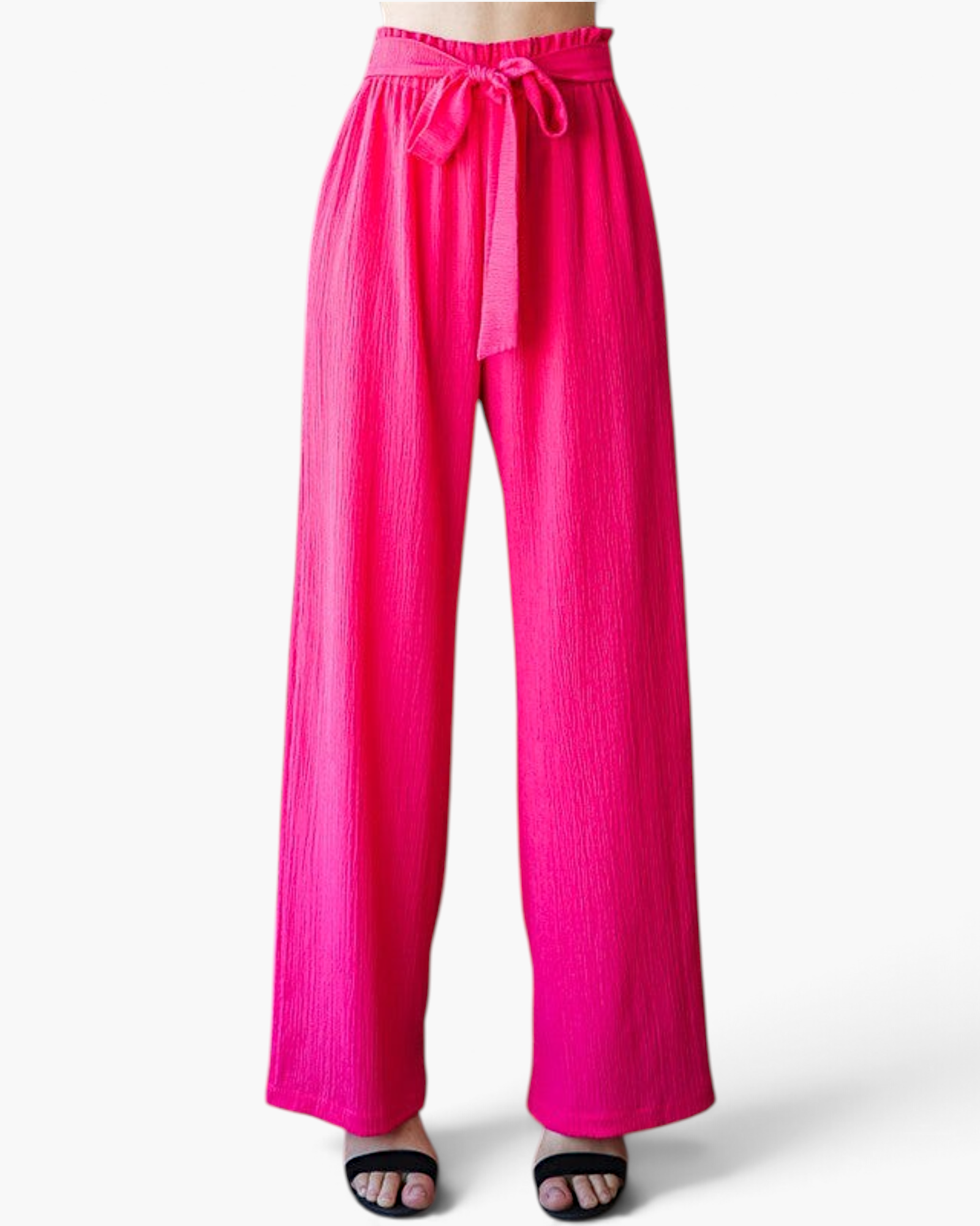 Beach Rose Co. fuchsia wide-leg pants with a textured finish, ruffled elastic waistband, and a front tie detail.