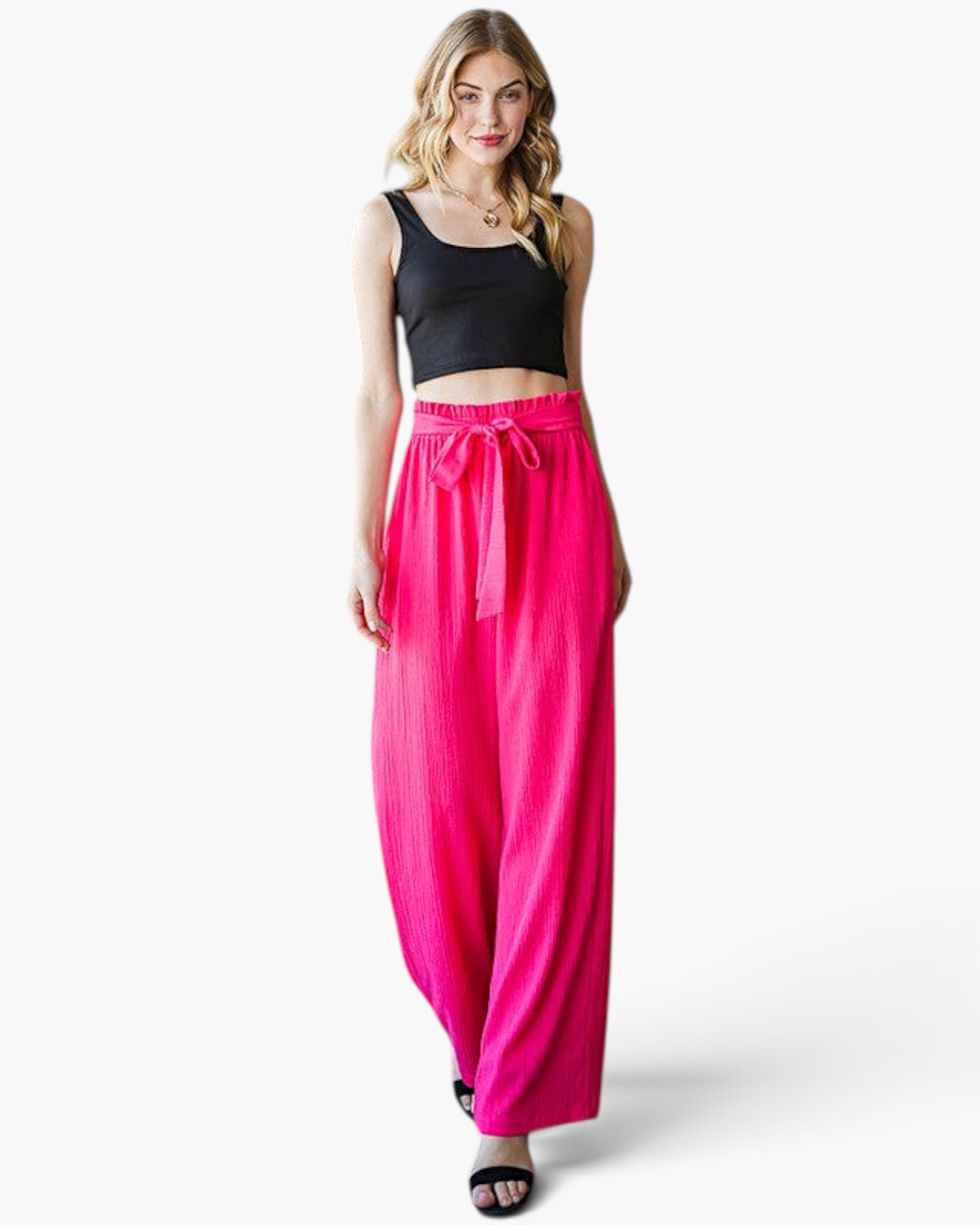 Beach Rose Co. fuchsia wide-leg pants with a ruffled elastic waistband and front tie on a blonde model