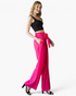 Beach Rose Co. fuchsia wide-leg pants with a ruffled elastic waistband and front tie on a model