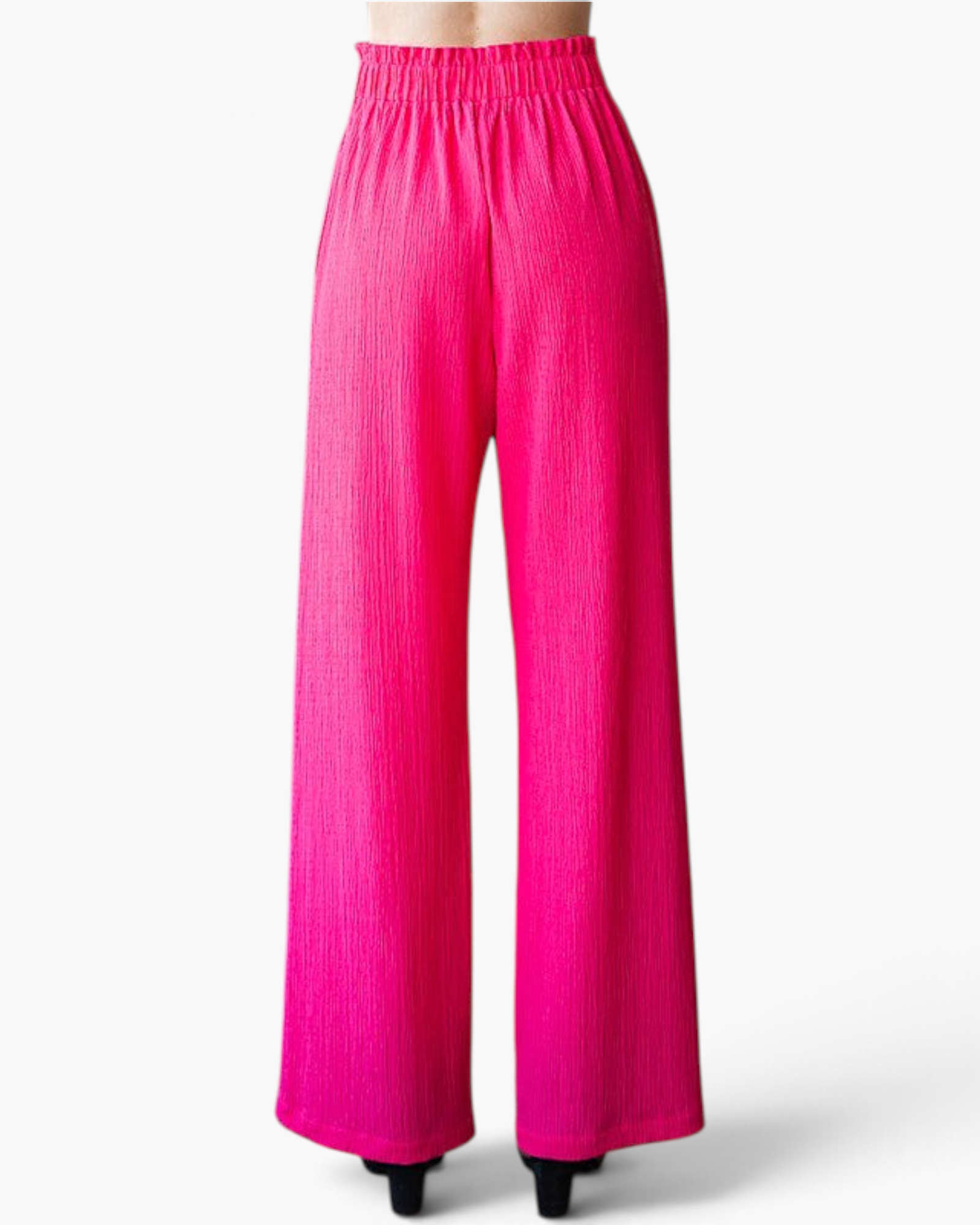 Beach Rose Co. fuchsia wide-leg pants with a textured finish and a ruffled elastic waistband, back view.