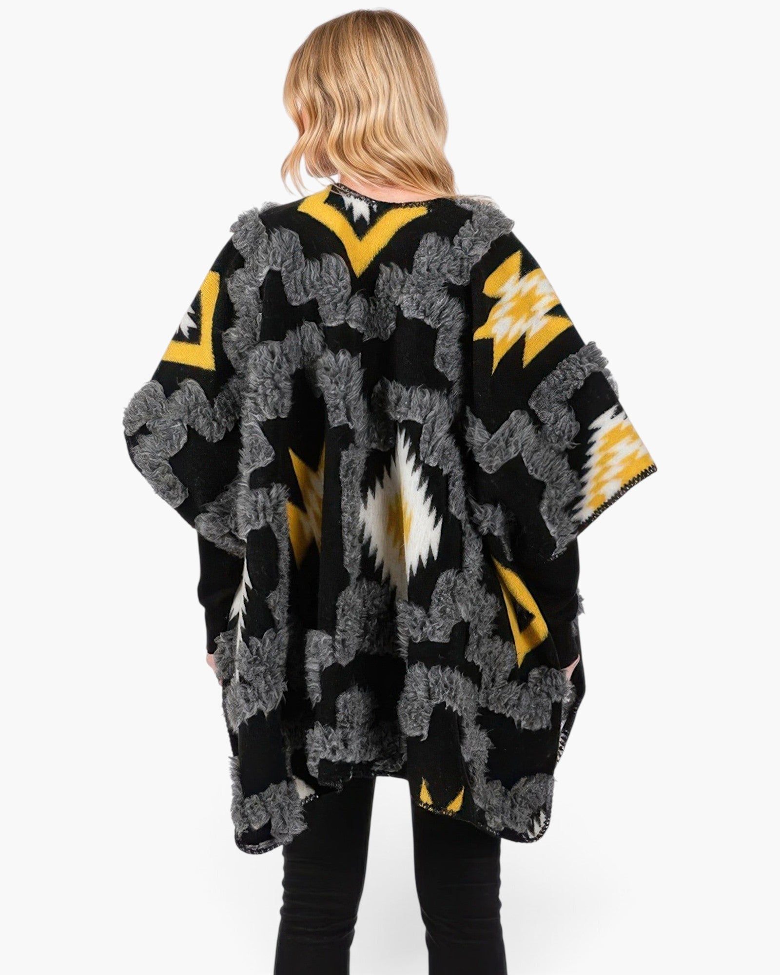 Beach Rose Co. fuzzy Aztec open-front ruana with a black, yellow, and white geometric pattern and textured trim.