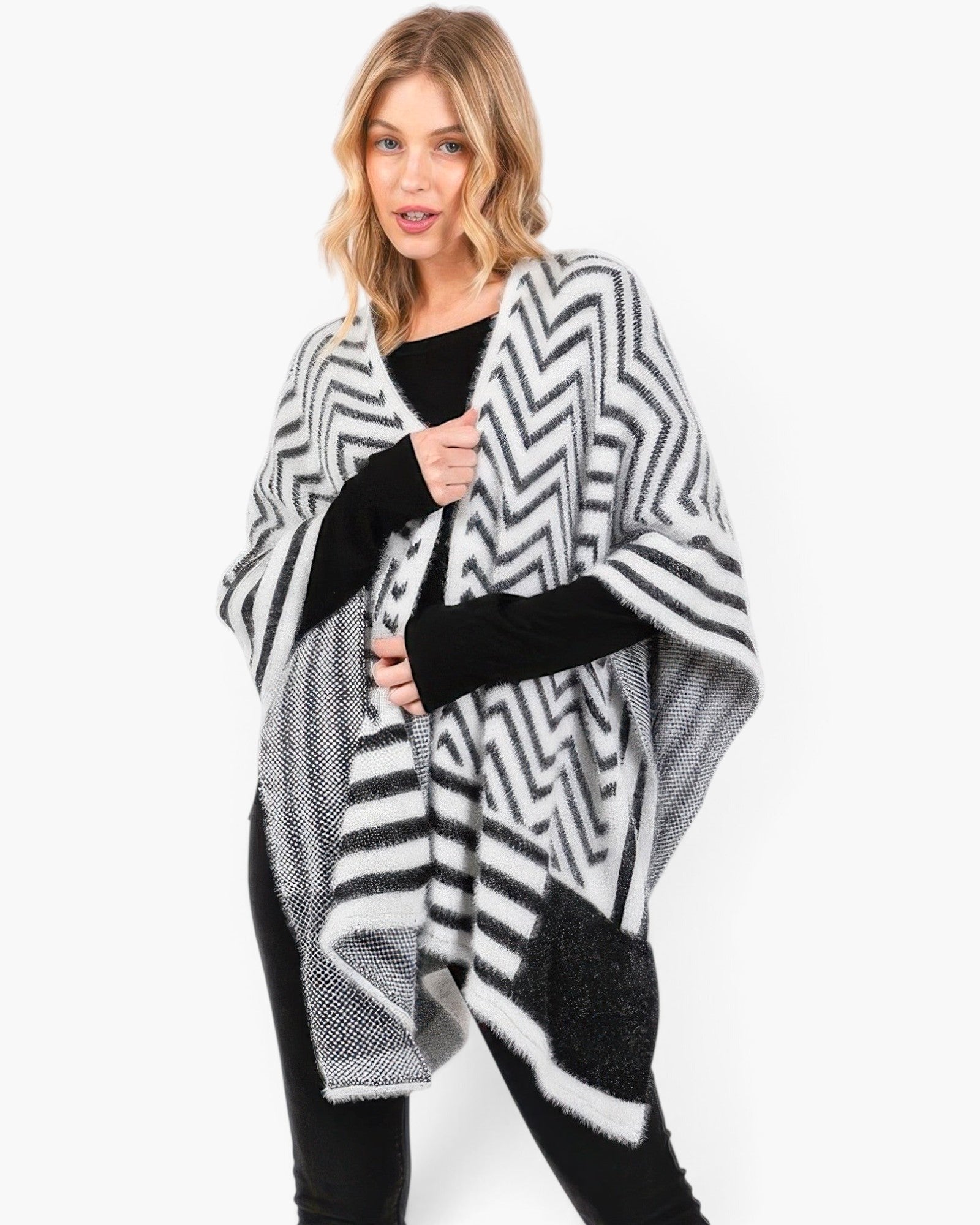 Beach Rose Co. fuzzy chevron pattern ruana in black and white worn over a black top for a stylish layered look.