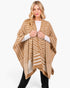 Beach Rose Co. fuzzy tan and white chevron pattern ruana worn by a woman over a white long-sleeve top and black pants.
