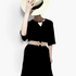 Beach Rose Co. stretch waist belt with a gold geometric alloy buckle worn over a black dress and straw hat