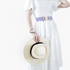 Beach Rose Co. purple stretch waist belt with a geometric alloy buckle worn over a white dress with a straw hat