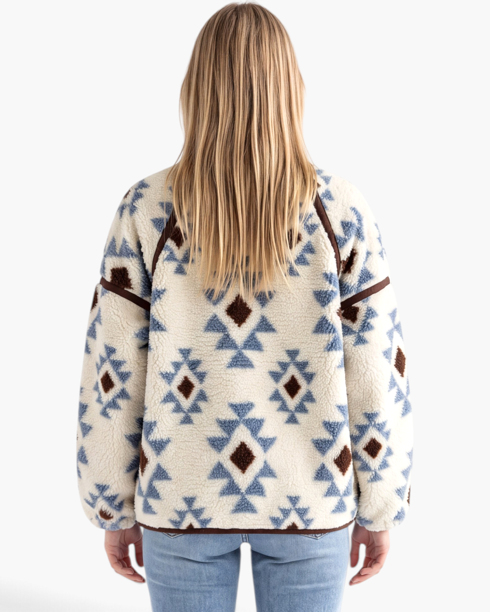 Back view of Beach Rose Co. cream sherpa pullover with blue and brown geometric patterns and brown seam detailing.