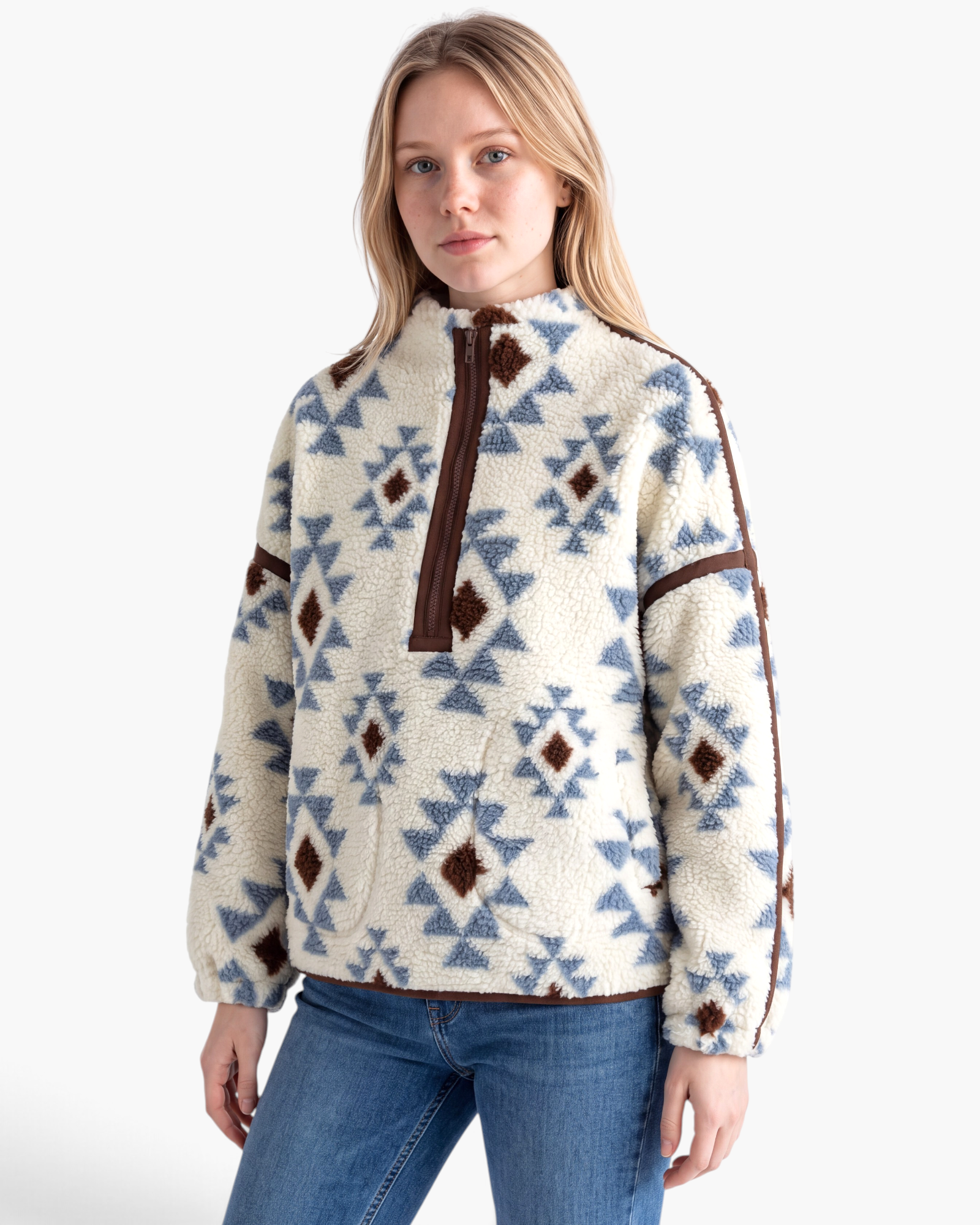 Beach Rose Co. cream sherpa pullover with blue and brown geometric patterns, half-zip collar, and brown trim.