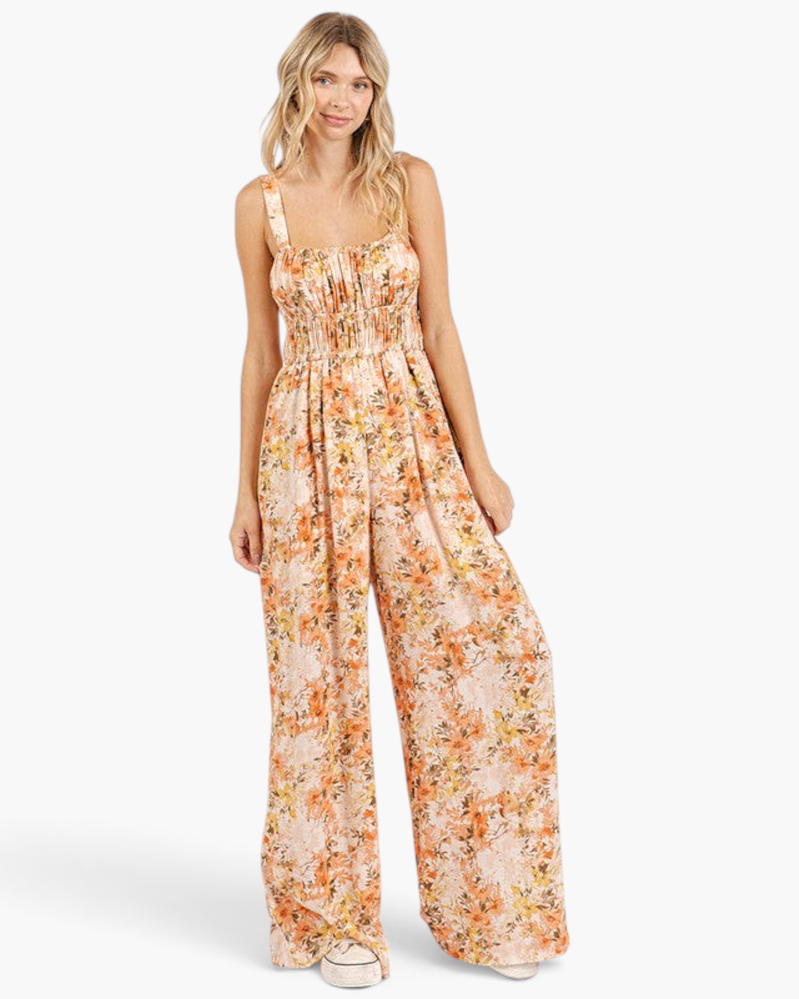 Beach Rose Co. ginger floral wide-leg jumpsuit with a smocked waist, square neckline, and gathered bodice on a model.