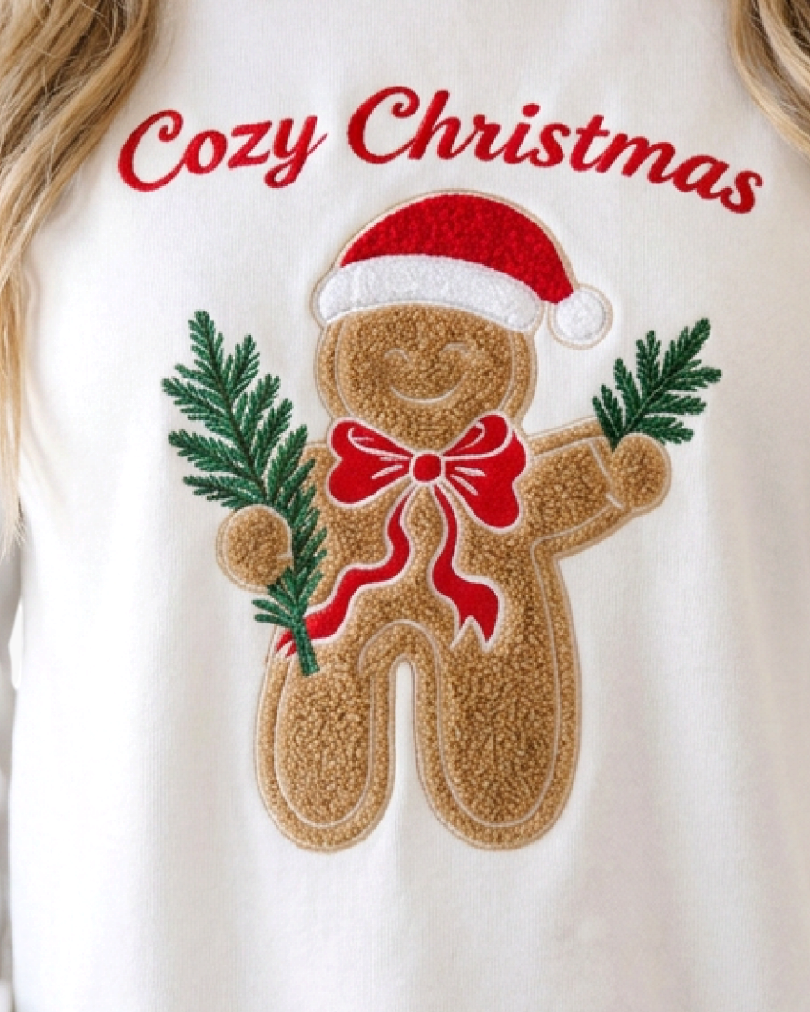Beach Rose Co. white sweatshirt featuring a textured gingerbread man appliqué with a Santa hat and evergreen branches.