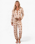 Beach Rose Co. cream and tan gingerbread print pajama set with V-neck top and joggers featuring a waist bow tie