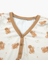 Beach Rose Co. cream gingerbread print pajama top with a tan V-neck and three-button placket detail