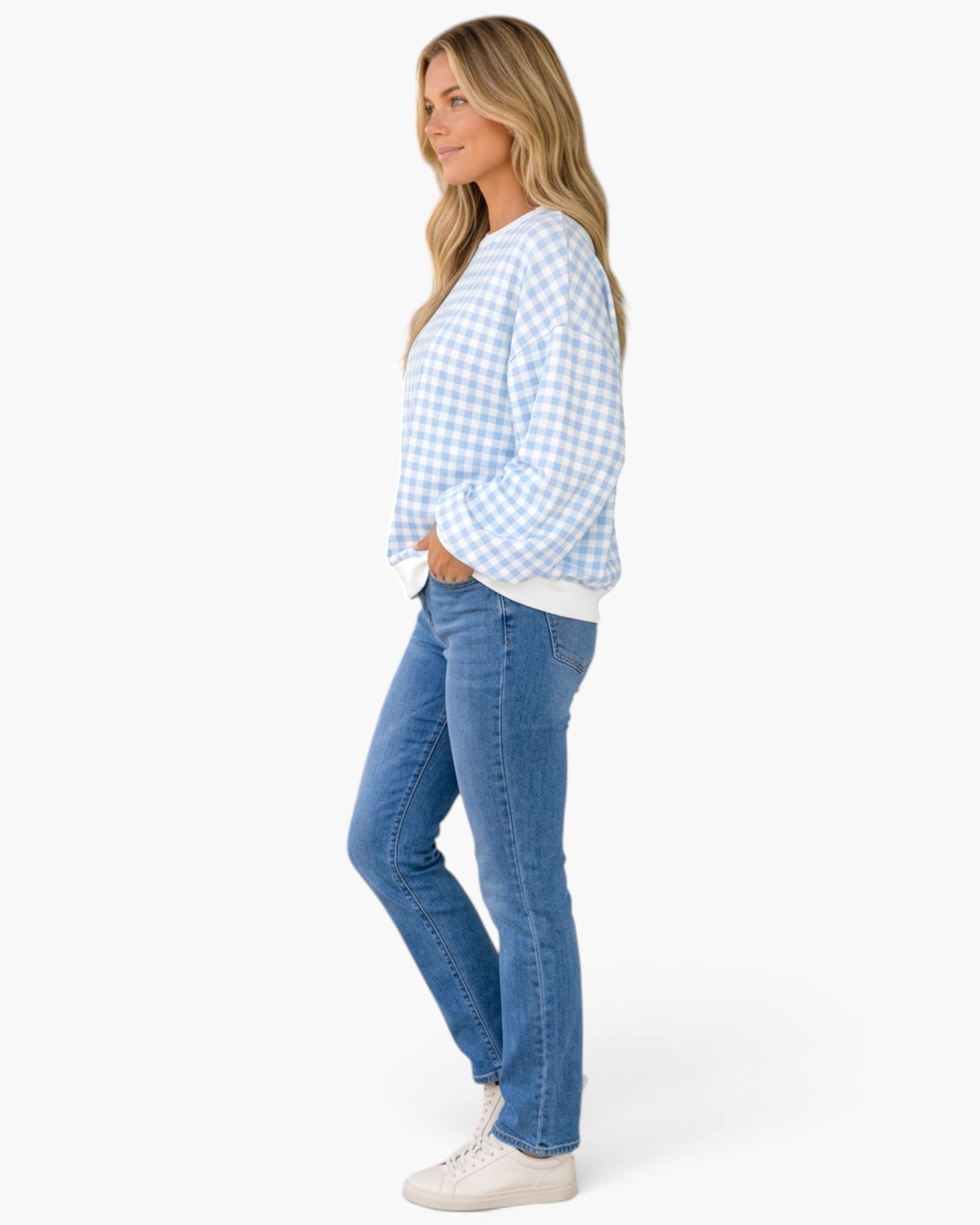 Beach Rose Co. light blue and white gingham sweatshirt with balloon sleeves worn by a model with blue jeans