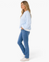 Beach Rose Co. light blue and white gingham sweatshirt with balloon sleeves worn by a model with blue jeans