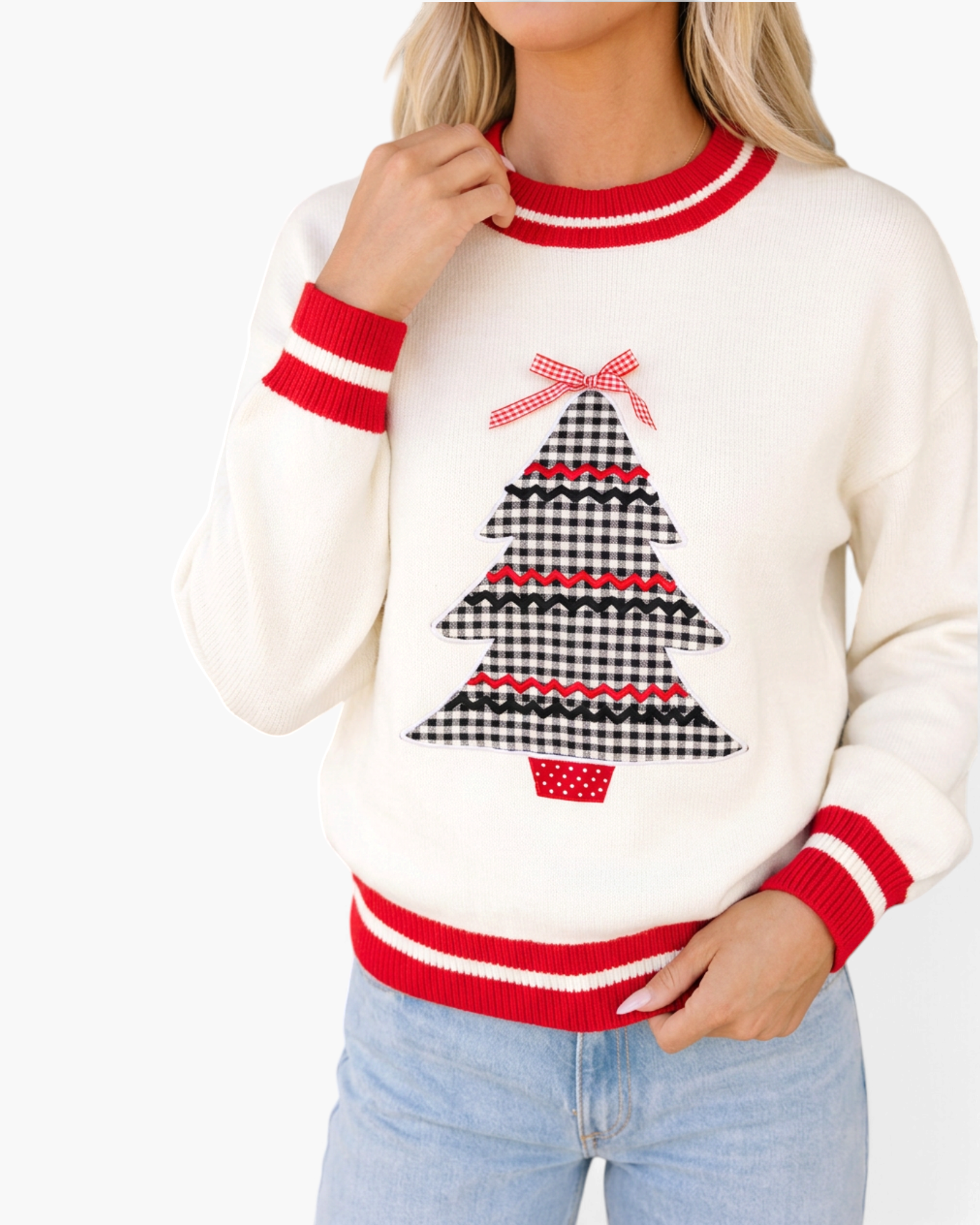 Beach Rose Co. cream sweater featuring a gingham Christmas tree appliqué, red bow, and striped red trim on cuffs.