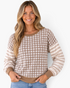 Beach Rose Co. taupe and cream gingham sweatshirt with striped sleeves, crew neck, and ribbed trim on a smiling model.
