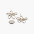 Beach Rose Co. gold-tone abstract flower earrings with delicate wire detailing shown next to a coin for scale.