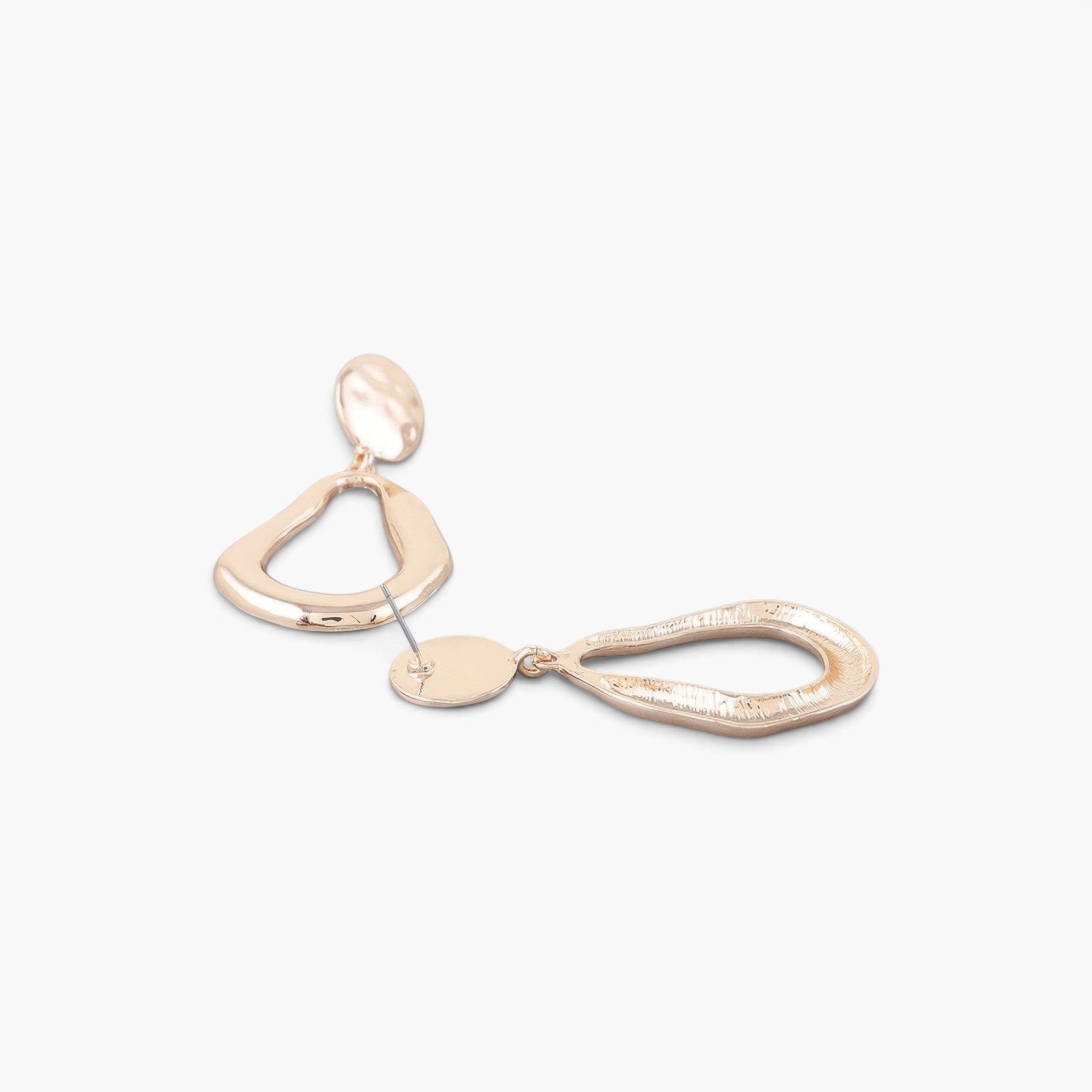 Beach Rose Co. abstract gold-tone teardrop earrings with a polished, reflective finish on a clean white background.