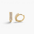 Beach Rose Co. gold huggie hoop earrings featuring a row of sparkling baguette-cut cubic zirconia stones.