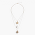 Beach Rose Co. 18K gold-plated layered necklace featuring sunburst, crescent moon, and zircon-accented pendants.