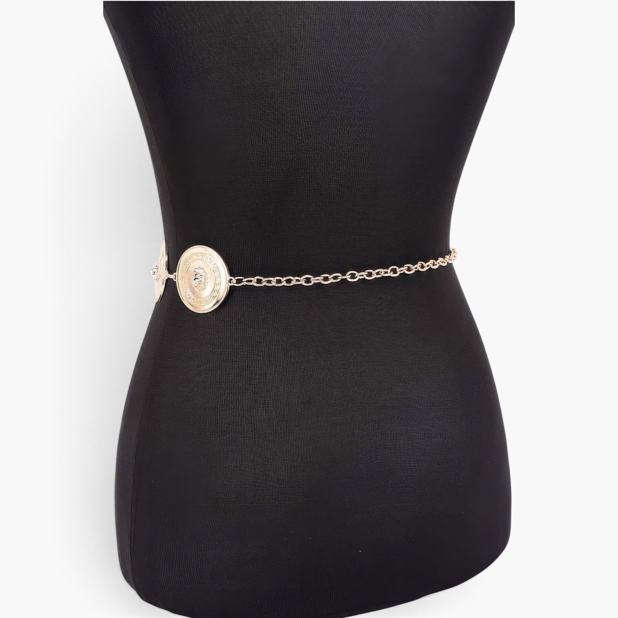 Beach Rose Co. gold metal chain belt featuring circular medallion accents on a black mannequin torso