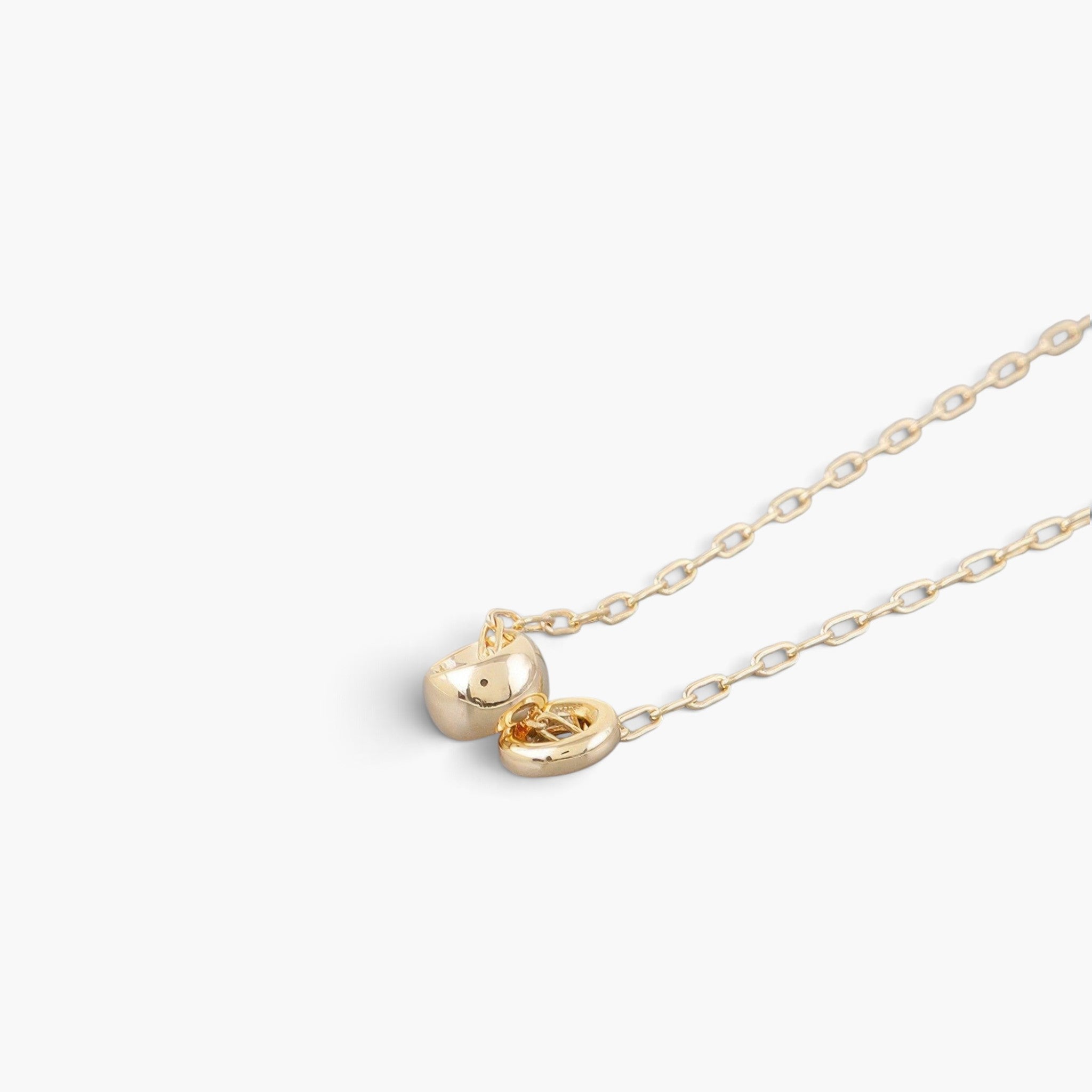 Beach Rose Co. gold chain necklace featuring two delicate interlocking ball charms on a simple link chain.