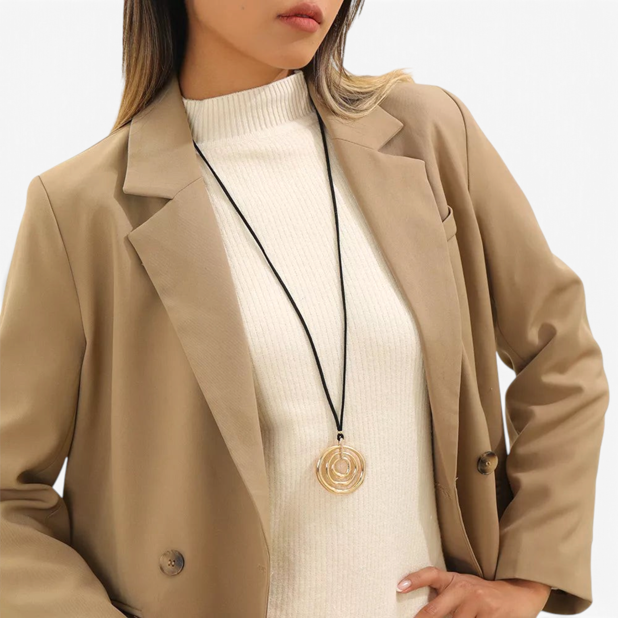 Beach Rose Co. long necklace featuring a gold-plated nested circle pendant on a black PU cord worn over a blazer.