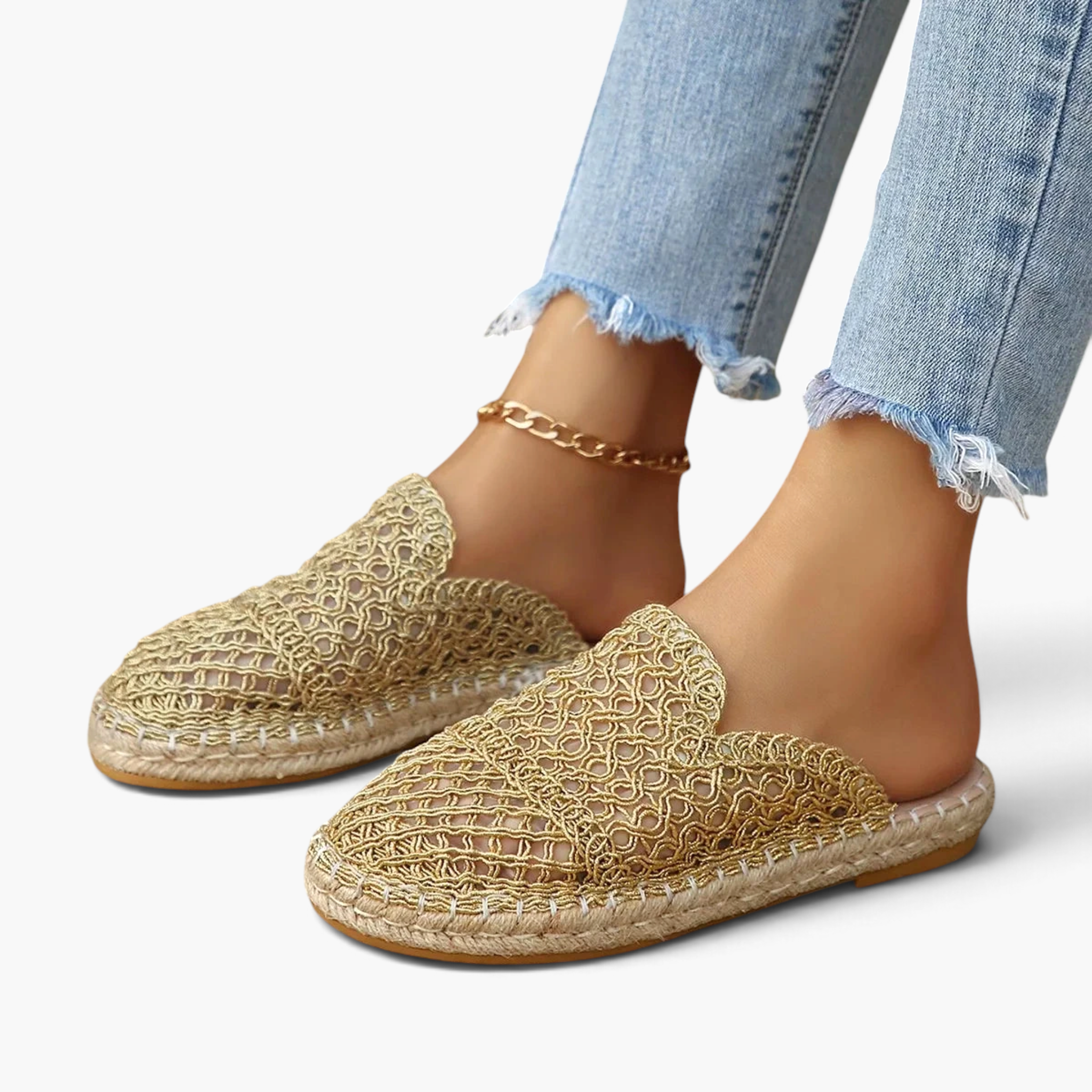 Beach Rose Co. gold crochet-style mesh espadrille mules with braided sole trim worn with cropped jeans.