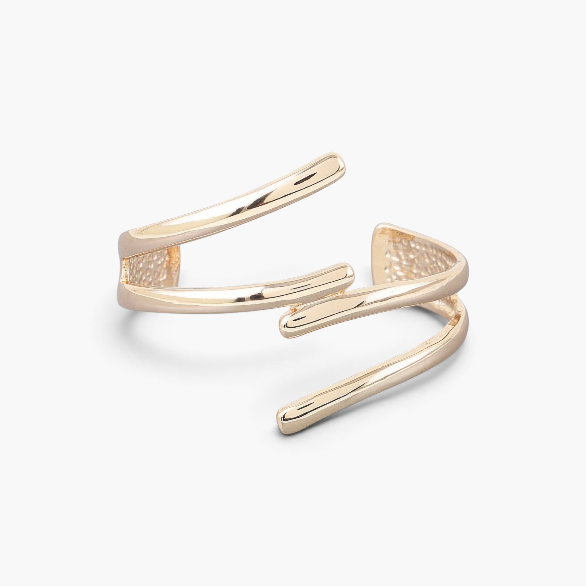 Beach Rose Co. delicate gold cuff bracelet with a minimalist open wrap design and polished metallic finish.