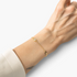 Beach Rose Co. gold filled chain bracelet with a sparkling cubic zirconia station worn on a wrist