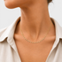 Beach Rose Co. delicate 18K gold filled choker necklace featuring sparkling cubic zirconia drop accents on a model