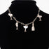 Beach Rose Co. gold chain necklace featuring whimsical party drink charms with sparkling clear jewels on a black bust