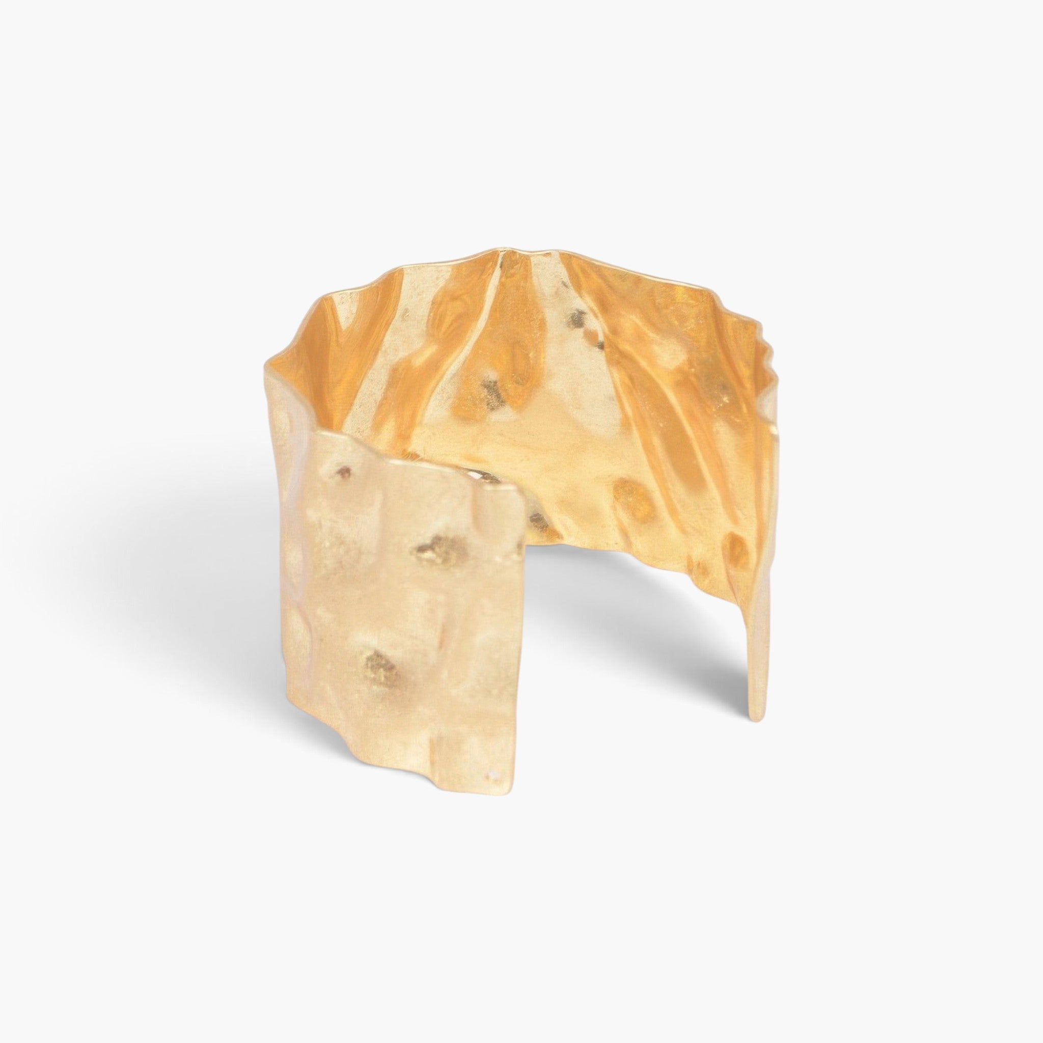 Beach Rose Co. gold metal cuff bracelet with a textured hammered finish on a clean white background